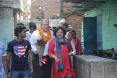1_1.-Mr-Edward-Davey-Secretary-of-State-for-Energy-and-Climate-Change-UK-entering-Kanak-Durga-slum-colony-with-Dr-Kiran-Martin