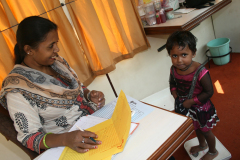 Ashas-field-staff-monitoring-children-health-in-Mobile-Health-Van