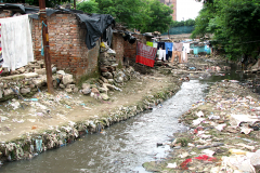 The-open-drain-flowing-behind-the-houses