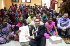 Irish-Minister-Damien-English-poses-for-a-group-photograph-with-the-womens-group-of-Dr-Ambedkar-slum-colony