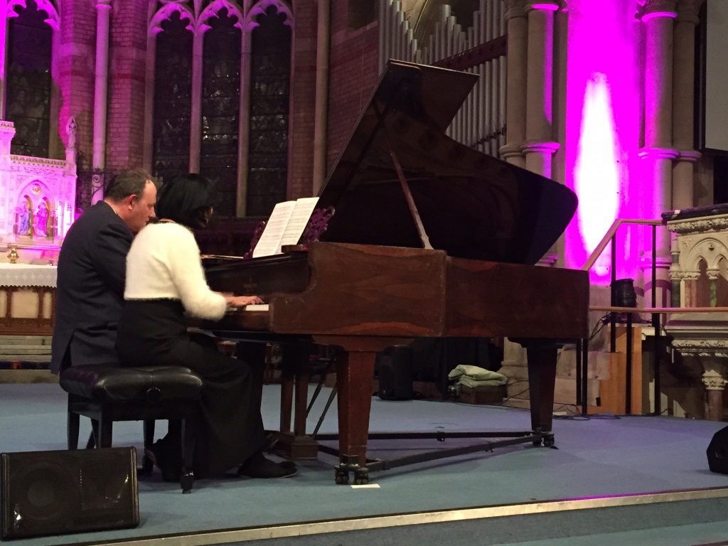 Jonathan and Enloc playing classical piano duets