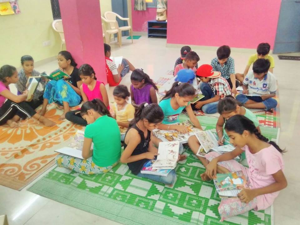 Bal Mandal children reading books at Ekta Vihar slum colony centre