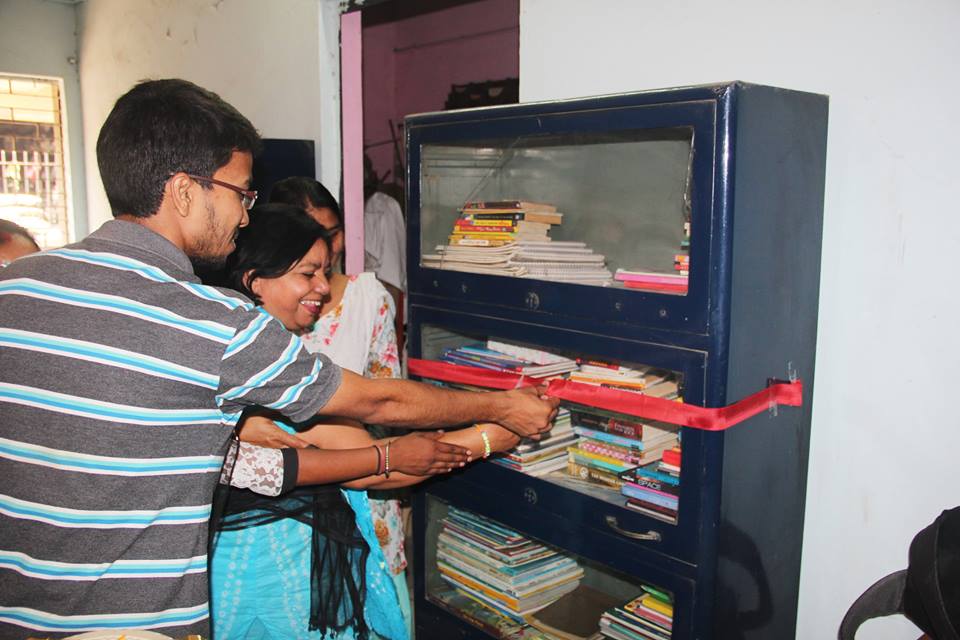 Library inauguration at Mayapuri slum colony by Asha staff Sweeta and Asha Student Ambassador Deepak