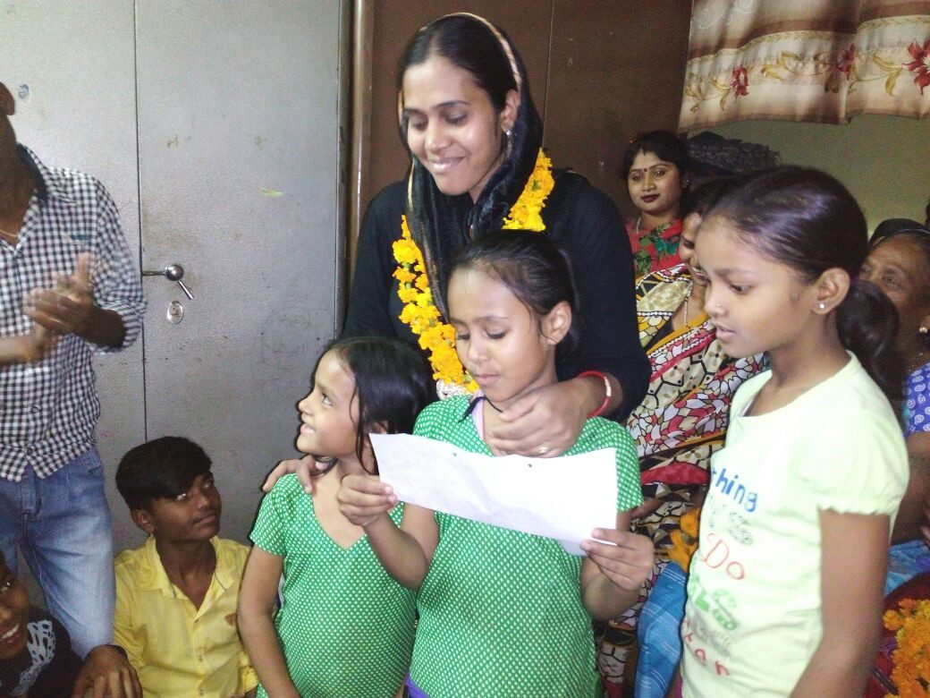 Children from Mobile Health Van area reciting a poem for their mother