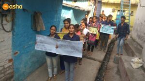 Asha's V. P. Singh Campus's children rallying across the slum