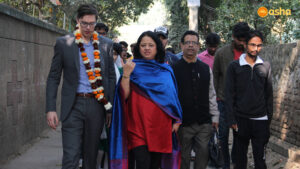 Dr. Kiran and Simon O' Connor on a visit around the slum