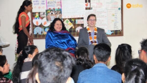 Simon sharing his experience with the Asha students