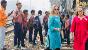 The team members of Wallace High School visiting the Asha's Mayapuri slum along the railway line