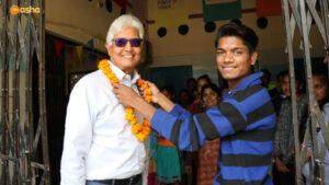 Dr Praveen being welcomed at Asha center