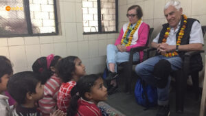 Gilah and Jack while interacting with the members of Bal Mandal