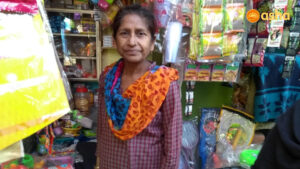 Santosh standing in front of her shop in Anna Nagar slum community