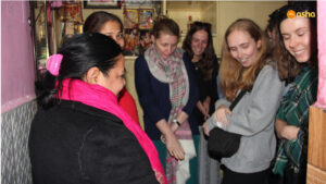 The team visiting Asha student's shanty