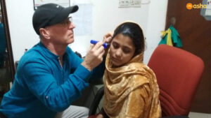 Dr Daniel (Audiologist) seeing a hearing-impaired patient