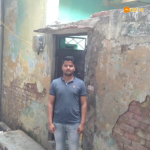 Harshit standing outside his home in Chanderpuri