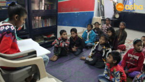 Pooja helping her peer revise a chapter at the Asha centre