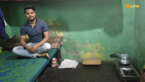 Harshit posing inside his home