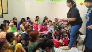 Macquarie team member distributing sanitary napkins at Asha's Kalkaji slum community