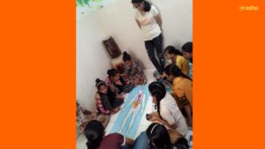 Avantika teaching a topic of Science to the children at Asha's Kalkaji slum community