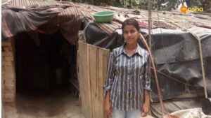 Sunaina in front her shanty