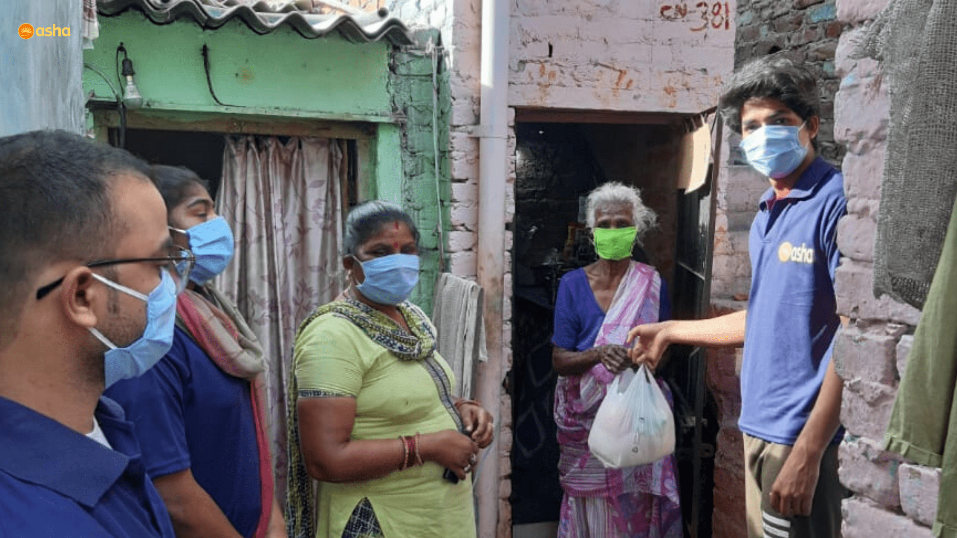 Asha COVID-19 Emergency Response: Asha warriors hand out essential groceries to the slum residents