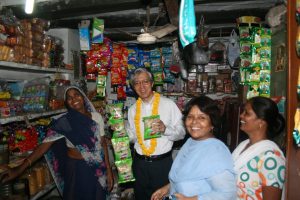 HE Takeshi Yagi with Kanta from Dr. Ambedkar slum colony who has taken a loan to set up her grocery shop