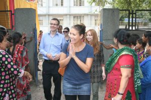Asha Team and community welcome the visitors to Asha’s community center at Jeevan Nagar slum colony