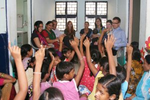 The group interacts with members of Asha’s children’s group