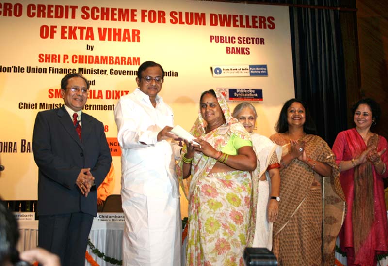 The then-Finance Minister, Mr P Chidambaram, presents cheques at an event to launch the loan scheme