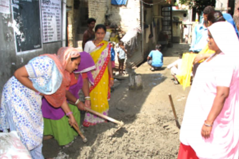 Women in Ekta Vihar take the initiative and pave a damaged road within their area