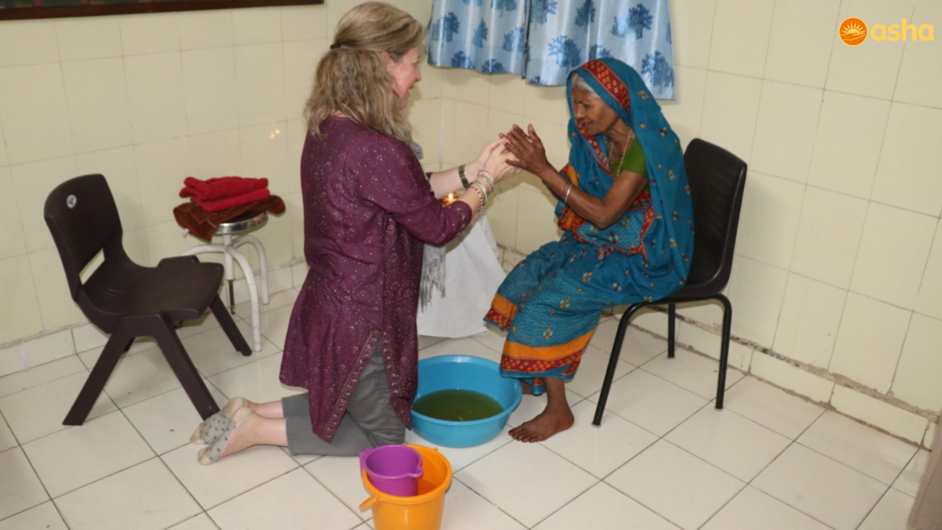 Governing Board members of Friends of Asha, Great Britain, wash the feet of the poor in the Mayapuri Slum Community